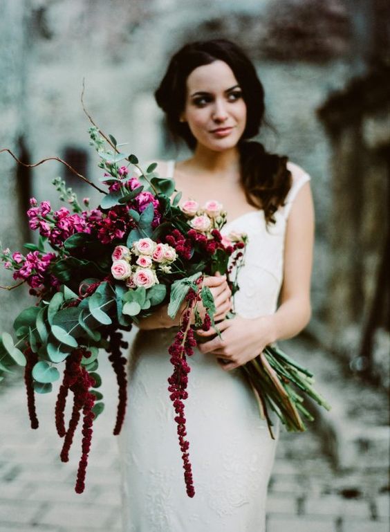 a bright long stem wedding bouquet with pink garden roses and hot pink and burgundy blooms plus twigs and euclayptus is amazing