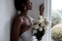 a chic and elegant white rose long stem wedding bouquet will never go out of style and will make your look very refined