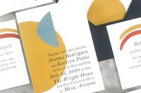 a colorful summer wedding invitation suite in black, grey, green, mustard and blue inspired by summer sunrises