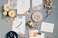 a colorful wedding invitation suite with teal and orange touches, with bold lettering and fun patterns is a lovely idea