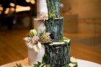a stylish forest-inspired wedding cake with buttercream and bark