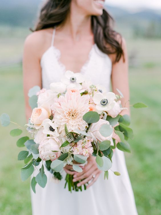 a delicate spring or summer wedding bouquet of blush peonies and dahlias plus white anemones and eucalyptus is chic