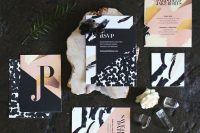 a gorgeous bold wedding invitation suite with black, white, blush and mustard touches and various abstract patterns