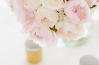 a gorgeous lush wedding centerpiece of white and blush peonies is a lovely idea for a summer wedding and is easy to make