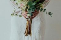 a long stem wedding bouquet of king proteas, eucalyptus, waxflowers is a beautiful idea with much texture and dimension