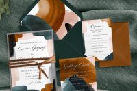 a moody abstract wedding invitation suite with teal, graphite grey, rust, blush touches, rust-colored envelopes and leather cord