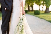 a romantic bridal look finished with a long stem white delphinium wedding bouquet is a gorgeous idea for a spring or summer bride