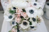 a sophisticated wedding bouquet of white anemones, peonies and blush roses looks very tender and sweet
