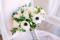 a stylish and classic wedding bouquet of white anemones and blush roses, with a silk grey ribbon wrap is wow