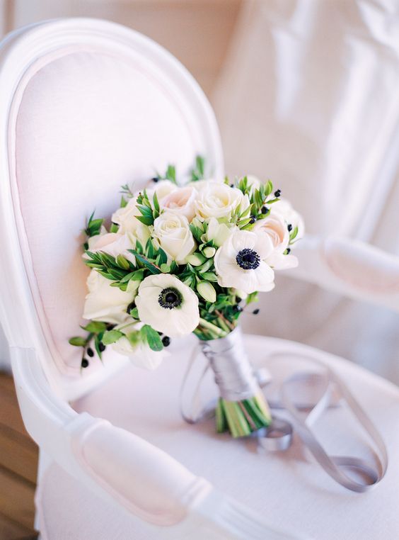 a stylish and classic wedding bouquet of white anemones and blush roses, with a silk grey ribbon wrap is wow