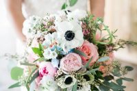 a summer wedding bouquet of pink peonies and roses, white anemones and greenery is a chic idea for a summer bride