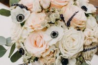 a tender wedding bouquet of white and blush roses, white anemones, lilac and greenery is amazing and beautiful