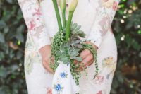 a very creative wedding bouquet of calla lilies, succulents and an embrodiered handkerchief is a very bright and cool idea