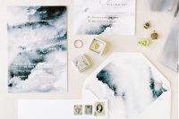 an abstract watercolor grey wedding invitation suite with white calligraphy is a dreamy idea for a winter wedding