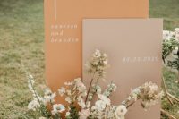 06 chic modern fall wedding signage in blush and rust, with pastel blooms and some greenery looks gorgeous and very stylish