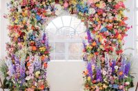 a super colorful wedding arch decor