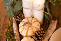 13 a cute DIY rustic wedding centerpiece of pumpkins, pinecones, branches, candles, baby’s breath and moss and greenery