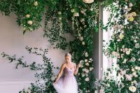13 a fantastic overgrown flower wedding backdrop of lots of roses, peonies and greenery is a dreamy idea for a spring or summer wedding