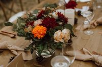 lovely fall rustic tablescape with bright blooms