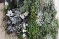 23 a wedding backdrop with lots of greenery and overgrown blooms hanging down is a gorgeous solution for a ceremony or photo booth