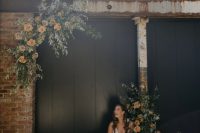 27 a simple modern fall wedding altar composed of greenery and rust-colored roses is a very stylish and cool idea