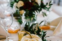 28 elegant rustic fall wedding table decor with a greenery runner, a white pumpkin with a number, gilded candleholders and chic touches
