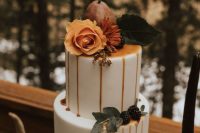33 a gorgeous modern fall wedding cake with caramel drip, a pear and blackberries, an orange rose and leaves is amazing