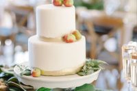 37 a simple modern fall wedding cake with gold touches and fresh apples and euclayptus is a very cool and beautiful idea