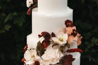 38 a sophisticated modern fall wedding cake with a rough edge, beautiful blush, burgundy blooms and bold foliage is amazing