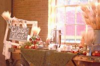 41 a chic fall wedding cider bar created of a cart, wheat, apples and pallets and drinks is ideal for a rustic wedding