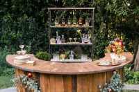 48 a stylish fall rustic wedding bar decorated with greenery and blooms plus a fall leaf arrangement on it is very cool