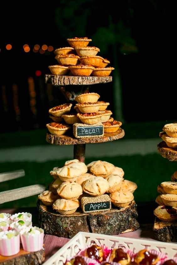 delicious home pies served on a wood slice stand is a cool and cozy idea for a rustic fall wedding, substitute a cake with them