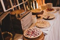 51 homemade pies are a delicious and cool alternative to a usual wedding cake at a rustic wedding in any season