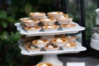 52 mini pumpkin pies with whipped cream are delicious for a rustic fall wedding and are very comforting and cool