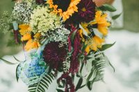 a cute fall wedding bouquet with yellow touches