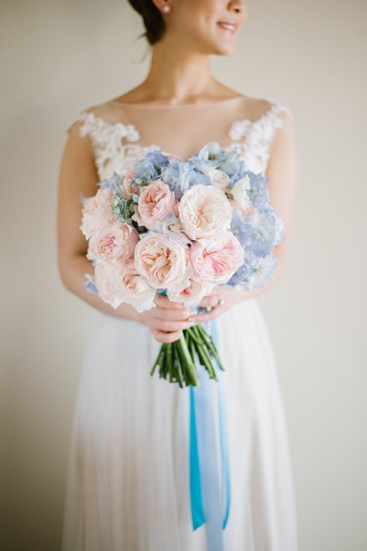 a chic and simple wedding bouquet of blush peonies and blue hydrangeas is a lovely idea for a spring or summer bride