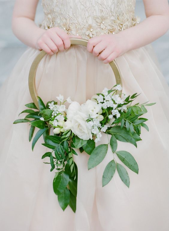 a chic gold hoop wedding bouquet with textural greenery and white blooms is a lovely idea for a spring or summer wedding