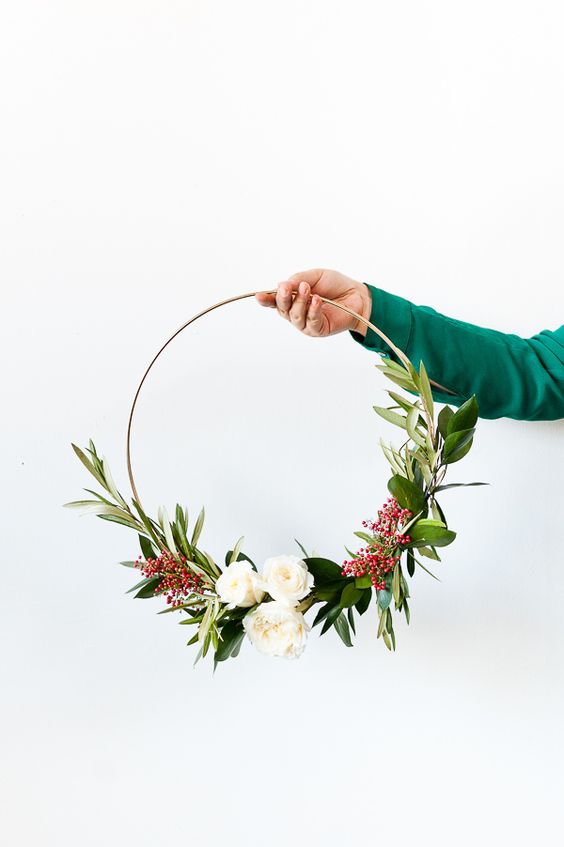 a chic hoop wedding bouquet with greenery, white ranunculus and berries is a stylish idea for a bride or bridesmaid