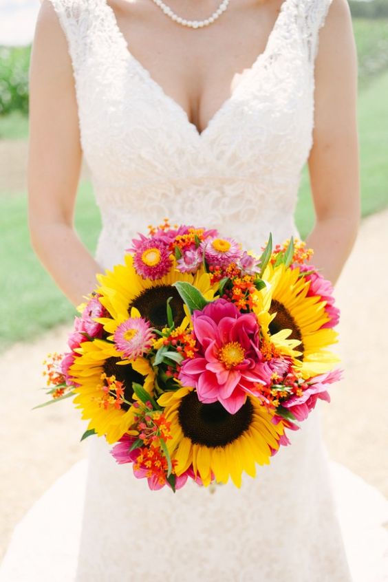 a colorful rustic chic wedding bouquet with pink blooms, greenery and sunflowers is a cool idea to rock for any rustic wedding