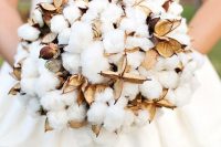 a creative fall or winter wedding bouquet made of cotton and dried elements shaped as a ball is a chic and cozy idea for a cold season