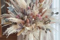 a dreamy dried flower wedding bouquet with pampas grass, lavender, allium, eucalyptus and some dried grasses is a lovely idea for spring or summer