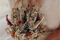 a dreamy rustic dried wedding bouquet with allium, roses, wheat, grasses, ferns, baby’s breath and twigs is a great idea for the fall or summer
