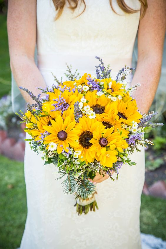 a laid back rustic wedding bouquet of sunflowers, lavender, daisies and greenery plus evergreens is easy to make yourself