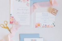 a lovely wedding invitation suite with blue envelopes, pink floral invites is a very elegant and cute solution to rock