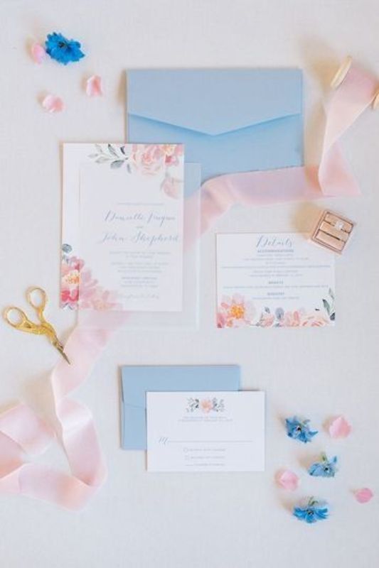 a lovely wedding invitation suite with blue envelopes, pink floral invites is a very elegant and cute solution to rock