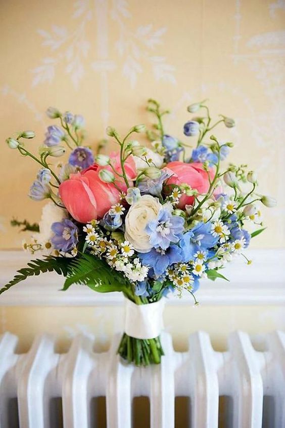 a lovely white, pink, blue and lilac flower wedding bouquet with greenery is a pretty idea for a summer bride