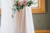 a refined hoop wedding bouquet with lush textural greenery, white blooms and pastel ones is a very delicate and chic idea