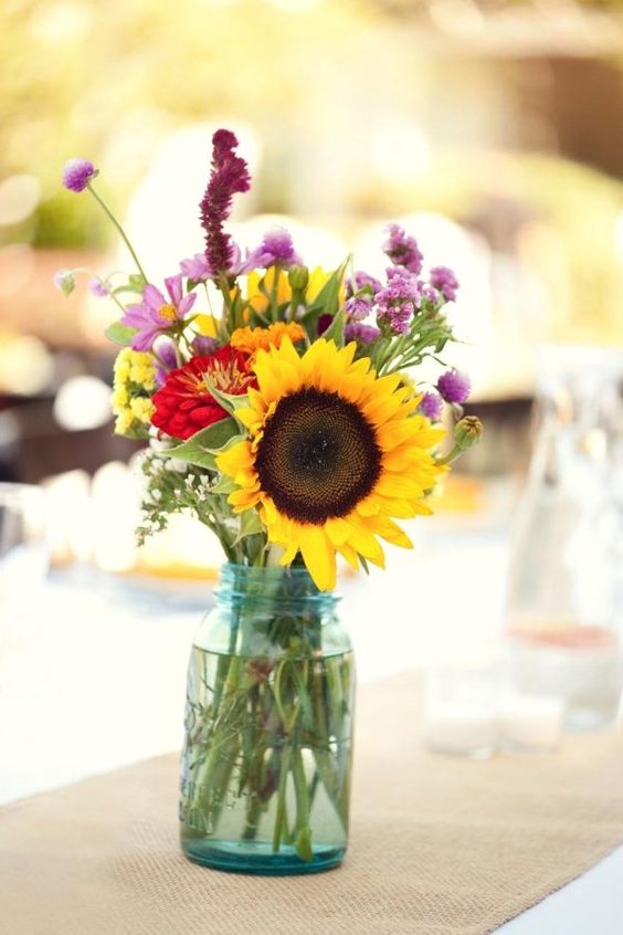 a simple yet cute centerpiece with sunflowers