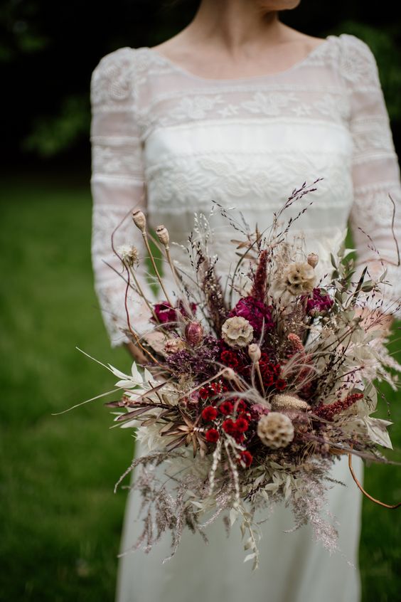 a super bold dried flower fall wedding bouquet with billy balls, seed pods, various wild grasses and wheat is cool