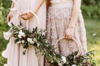 pretty textural and dimensional hoop wedding bouquets with lush greenery, white and deep purple blooms plus some berries are amazing for the fall